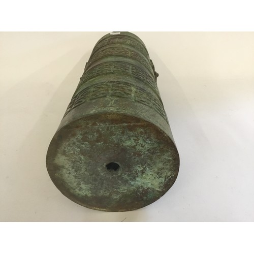 313 - A Tang Style Two Handled Waring States Cast Bronze Cannon Shot Carrier. Measuring: 37cms high.