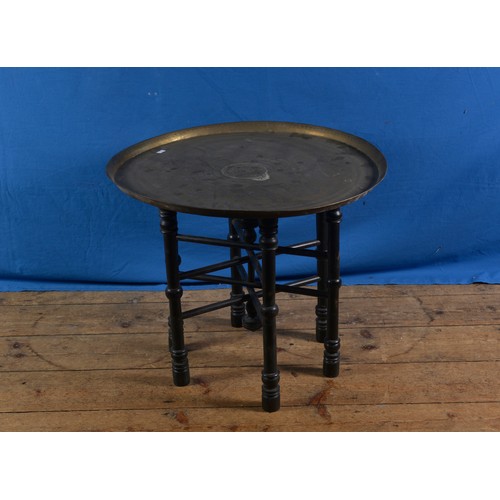 323 - A Benares Brass engraved Tiffin Table on a Wooden Stand. Measuring: 56cms across.