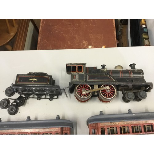 1131 - An Electric 'O' Gauge Marklin Locomotive & Tender along with Two Coaches marked 