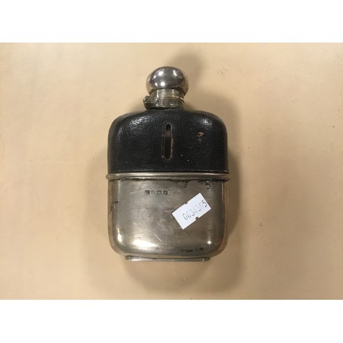 19 - A Silver Hip Flask in a Glass & Leather mounted case with a Bayonet fitting.