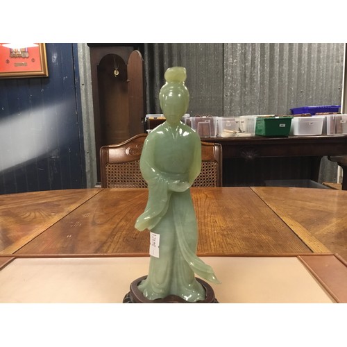 316 - A Chinese Jade Study of a Princess on Wooden Stand. Standing 20.5cms excluding stand. The head appea... 