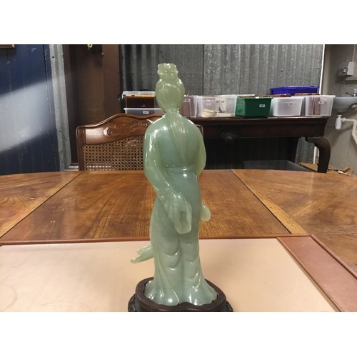 316 - A Chinese Jade Study of a Princess on Wooden Stand. Standing 20.5cms excluding stand. The head appea... 