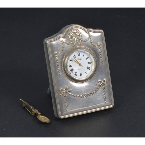 51 - A Silver Fronted Bedside Clock & a Silver Coronation Spoon Brooch.