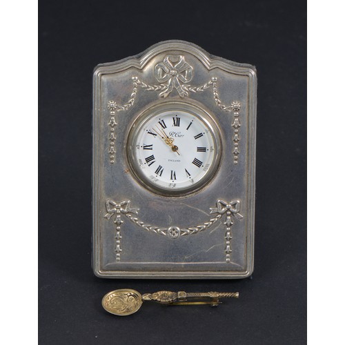 51 - A Silver Fronted Bedside Clock & a Silver Coronation Spoon Brooch.