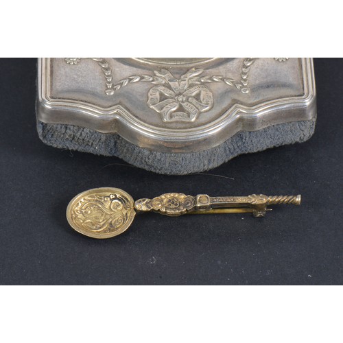 51 - A Silver Fronted Bedside Clock & a Silver Coronation Spoon Brooch.