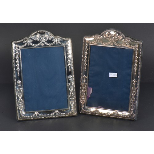 59 - A Pair of Modern Silver Photo Frames with Ribbon decoration. Measuring: 12cms x 7cms. (Picture Size)... 