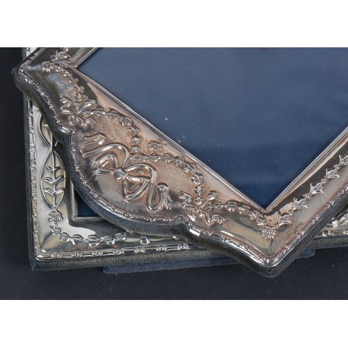 59 - A Pair of Modern Silver Photo Frames with Ribbon decoration. Measuring: 12cms x 7cms. (Picture Size)... 