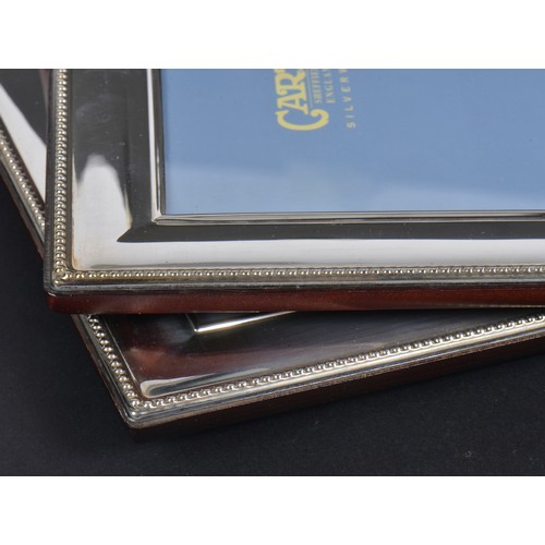 63 - Two Silver Picture Frames. Measuring: 18cms x 13cms. (Picture Size).