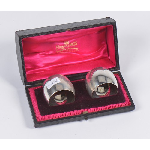 69 - A Pair of Silver Napkin Rings in Case. Weighing: 62 grams.