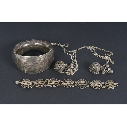 73 - An Indian Hammered & Engraved Bangle along with other Indian jewellery.