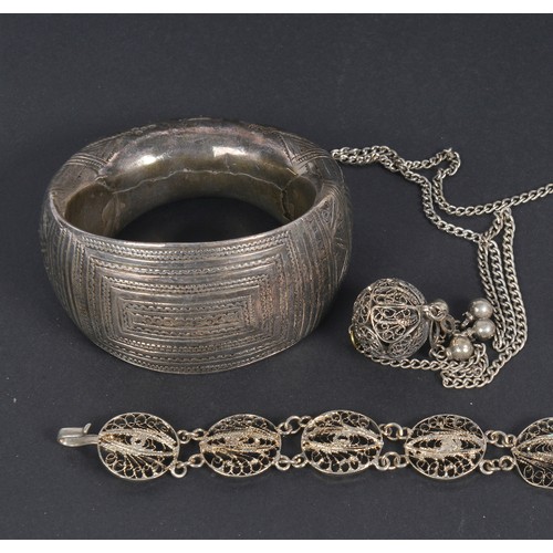 73 - An Indian Hammered & Engraved Bangle along with other Indian jewellery.