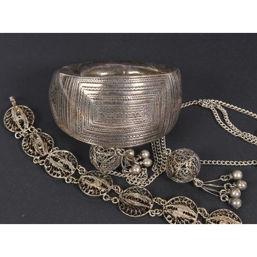 73 - An Indian Hammered & Engraved Bangle along with other Indian jewellery.