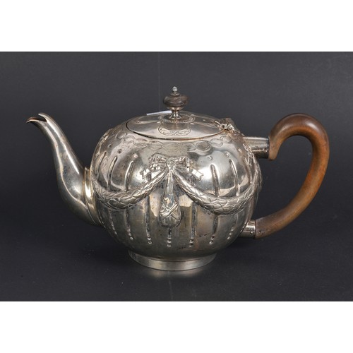 74 - A Victorian Silver Swag & Bow decorated Bullit shaped Tea Pot with armorial crest of a standing Lion... 