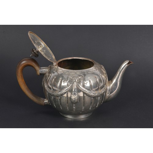 74 - A Victorian Silver Swag & Bow decorated Bullit shaped Tea Pot with armorial crest of a standing Lion... 