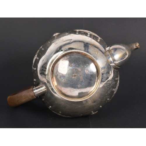 74 - A Victorian Silver Swag & Bow decorated Bullit shaped Tea Pot with armorial crest of a standing Lion... 