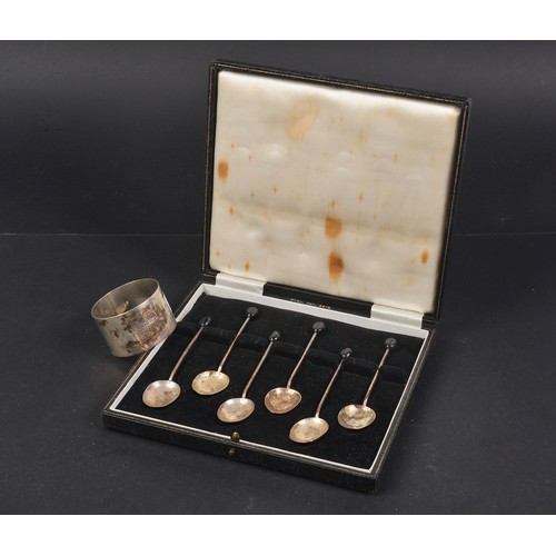 80 - A Cased Set of Bean Handled Silver Coffee Spoons & a Silver Napkin Ring. Weighing: 51 grams.