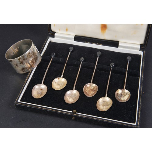 80 - A Cased Set of Bean Handled Silver Coffee Spoons & a Silver Napkin Ring. Weighing: 51 grams.