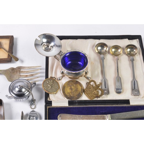 100 - A Silver Plated Sugar Castor, Paper Knife, Silver Sugar Tongs, Silver Plated Cutlery, etc.