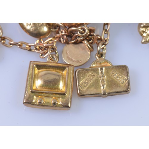 151 - A 9ct Gold Charm Bracelet hung with various charms. Weighing: 14 Grams. (Gross).