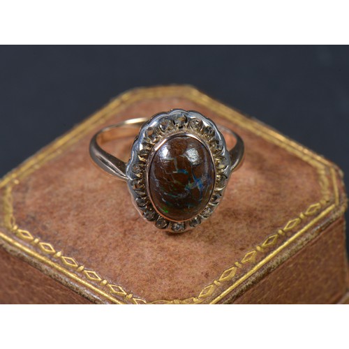 158 - A Ladies 18ct Gold & Black Cabochon Opal Dress Ring set with 18 Rose Cut Diamonds in Case. Weighing:... 