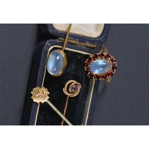 159 - A Ladies 9ct Gold Moonstone & Garnet Ring. Weighing: 3.3 grams. Along with Three Stick Pins.