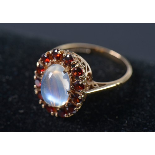 159 - A Ladies 9ct Gold Moonstone & Garnet Ring. Weighing: 3.3 grams. Along with Three Stick Pins.