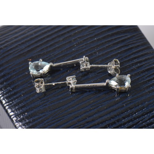 160 - A Pair of 9ct White Gold Aquamarine Long Drop Earrings.