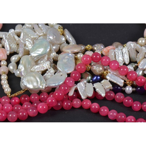 184 - A Collection of Fresh Water & Culture Pearls along with a Three Strand Pink Bead Necklace.