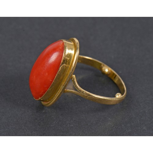 196 - A Ladies Coral Ring in a unmarked mount. Size I.