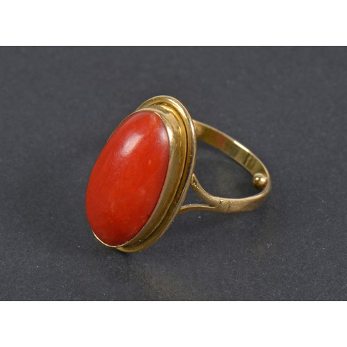 196 - A Ladies Coral Ring in a unmarked mount. Size I.