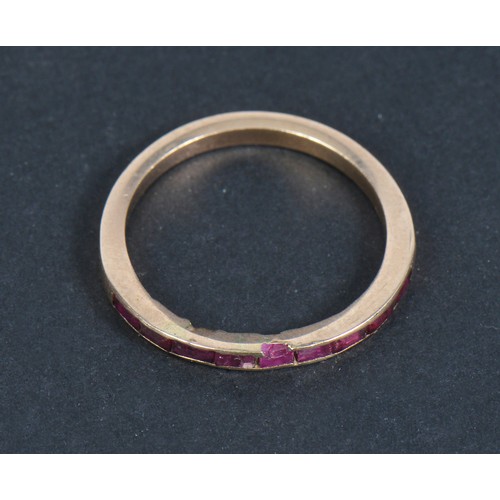 197 - A Ladies Ruby Dress Ring set with a Narrow Band of Ruby's. Size: R.