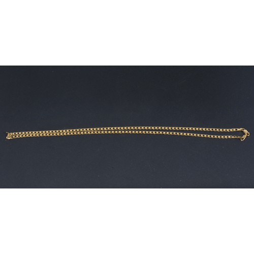 215 - A 9ct Gold Italian made Flattened Curb Chain. Weighing: 12.4 grams. Measuring: 60cms.