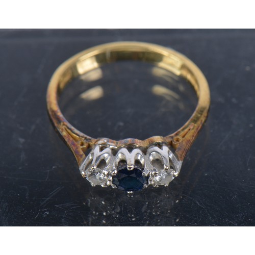 220 - An 18ct Gold Three Stone Sapphire & Diamond Ring. Size: M. Weighing: 2.9 grams.