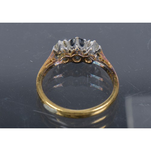 220 - An 18ct Gold Three Stone Sapphire & Diamond Ring. Size: M. Weighing: 2.9 grams.