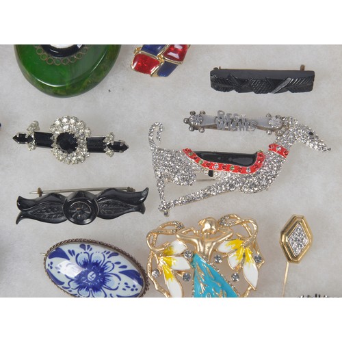 239 - A Collection of 16 Costume Jewellery Brooches to include a pair of Clip-on Earrings.