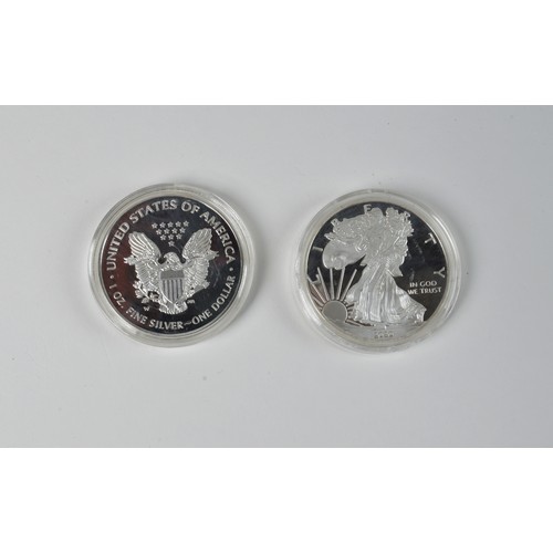 299 - A Pair of Liberty United States of America 1oz Fine Silver Dollars in Plastic Proof Cases.