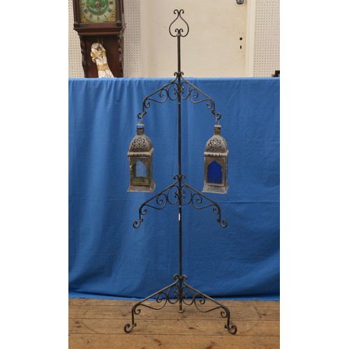 478 - An Iron Garden Corner Lamp Holder of swirl pattern. Standing: 167cms high.