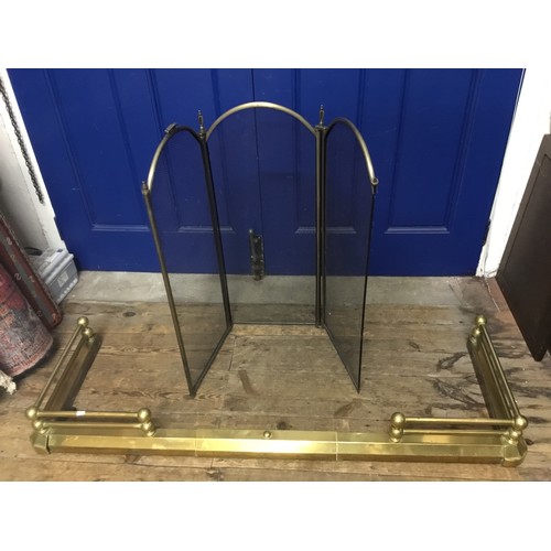 487 - A Brass Fire Surround of shaped proportions. Measuring: 140cms across x 39cms deep. Along with a Fol... 