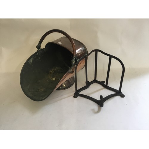 489 - An Antique Copper Helmet Shaped Coal Scuttle & a Wrought Iron Saddle Rack.