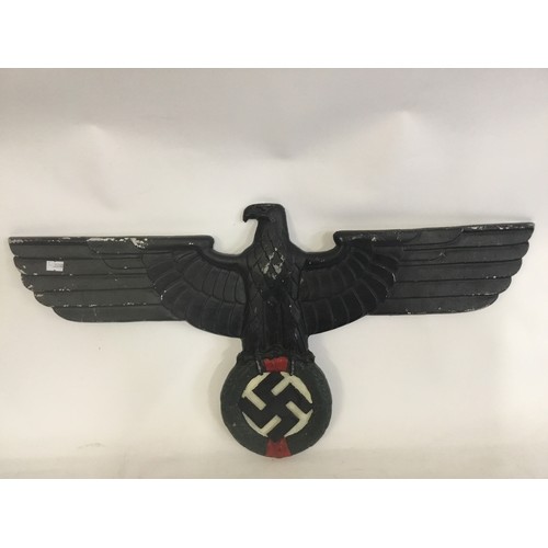 497 - An Aluminium Nazi design Black painted Eagle & Swastika in Oak Leaf Plaque. Measuring: 67cms across ... 