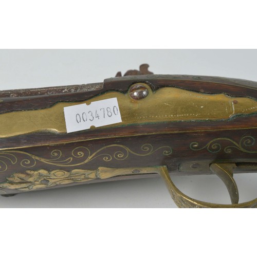 505 - An Antique Ottoman Turkish Empire Flintlock Action Pistol with Brass inlaid Stock engraved floral Gu... 