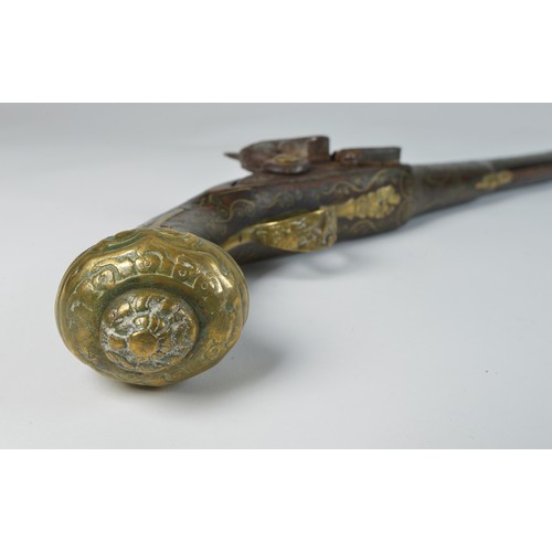 505 - An Antique Ottoman Turkish Empire Flintlock Action Pistol with Brass inlaid Stock engraved floral Gu... 