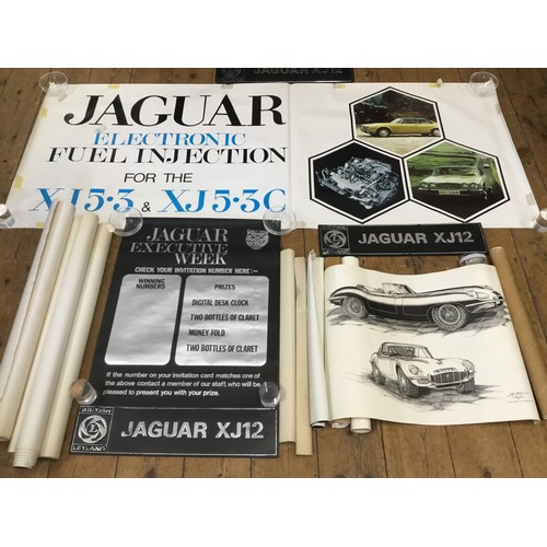 542 - A Collection of Jaguar Dealership/Factory Posters along with Three Showroom Plastic Number Plates de... 