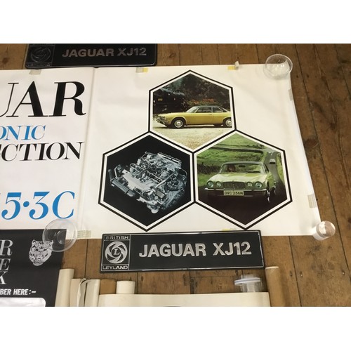 542 - A Collection of Jaguar Dealership/Factory Posters along with Three Showroom Plastic Number Plates de... 