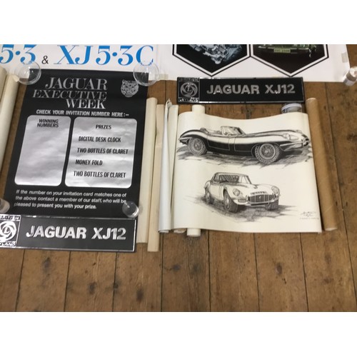 542 - A Collection of Jaguar Dealership/Factory Posters along with Three Showroom Plastic Number Plates de... 