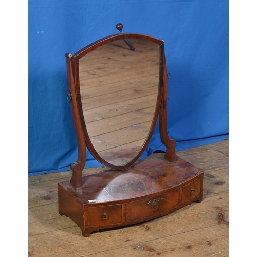 568 - A Regency Shield shaped Swing Framed Dressing Table Mirror in Mahogany fitted with three Drawers.