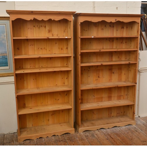 569 - Two Pine Book Shelves with adjustable Shelving with shaped apron. Measuring: 182cms/180cms High x 91... 