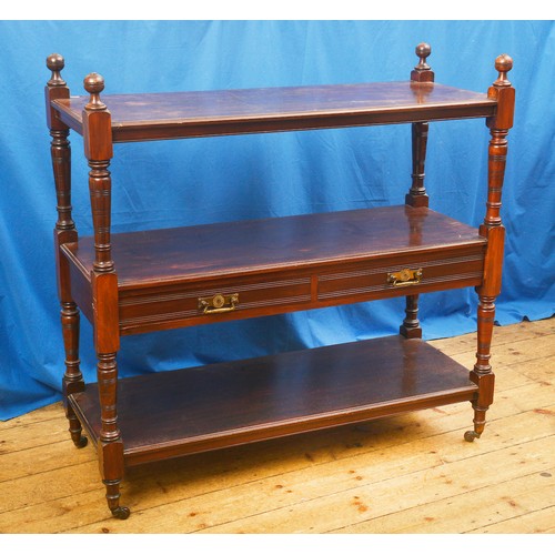 581 - A Late 19th Century Mahogany Three Tiered Buffet with turned supports. Measuring: 123cms long x 48cm... 