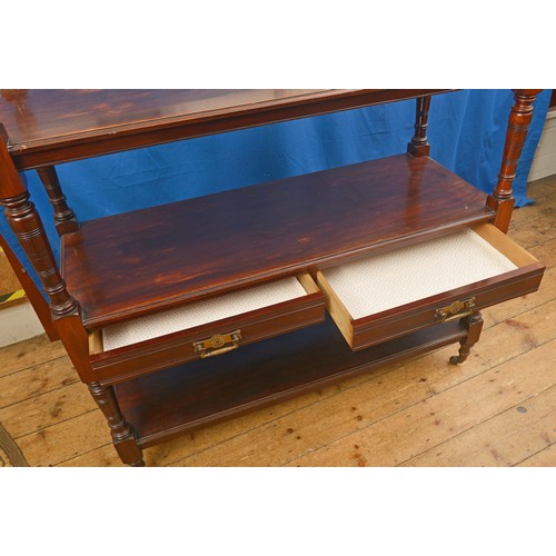 581 - A Late 19th Century Mahogany Three Tiered Buffet with turned supports. Measuring: 123cms long x 48cm... 