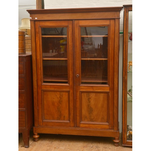 583 - A Continental Mahogany Two Door Bookcase fitted with Shelves. Measuring: 110cms across x 36cms deep ... 